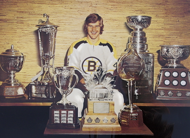 Bobby Orr with the collection of NHL Trophy's he has won - 1970s