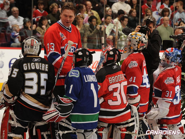 Patrick Roy talking with young goaltenders during a clinic