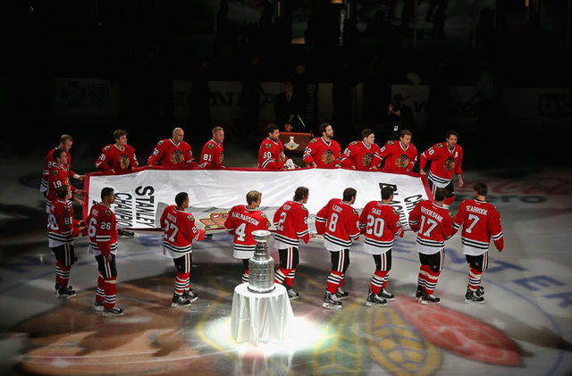 Chicago Blackhawks Carry Championship Banner Past Stanley Cup