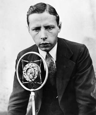 Foster Hewitt at microphone for Hockey radio broadcast in 1930s