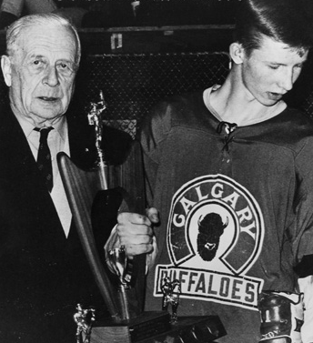 Lloyd Turner presenting AJHL MVP Trophy to Gary Unger 1965