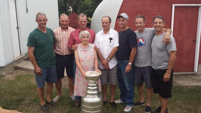 Sutter Brothers with their mom Grace, holding the Stanley Cup