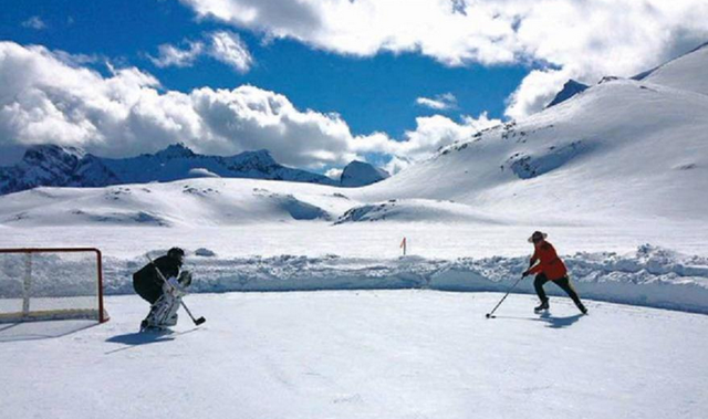 RCMP in Full Uniform Playing Pond Hockey on Purcell Glacier 2015