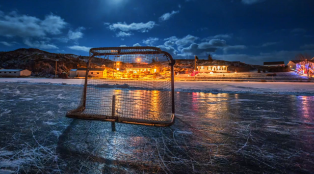 Hockey net reflecting on the pond in Labrador
