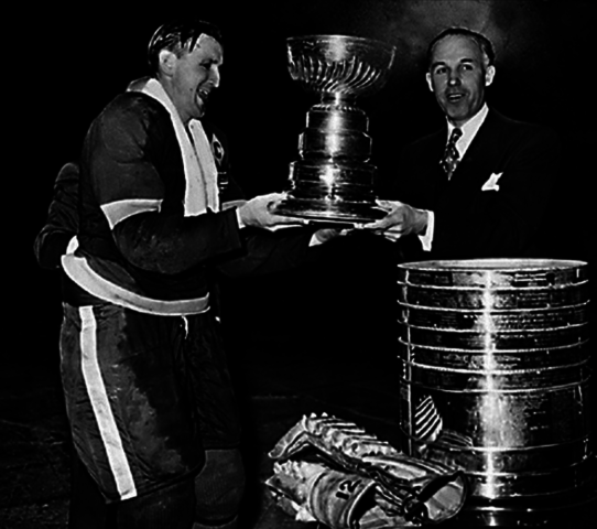 Detroit Red Wings Sid Abel accepts the 1943 Stanley Cup from Clarence Campbell