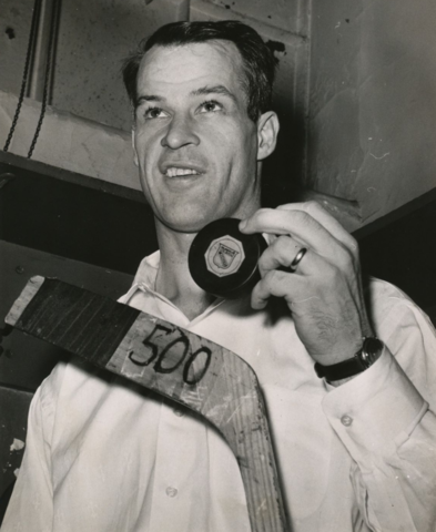 Gordie Howe with 500 Goal Puck and Stick - March 14, 1962