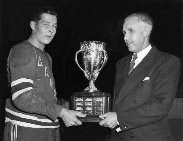 Pentti Lund receives the 1949 Calder Memorial Trophy from Clarence Campbell