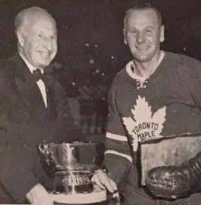 Johnny Bower accepts the 1960 J. P. Bickell Memorial Award from Keiller Mackay