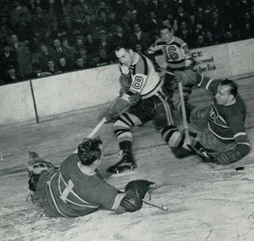 Bill Durnan of Canadiens makes save vs Knobby Warwick of Bruins 1947