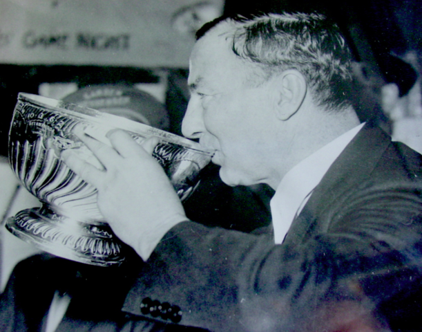 Art Ross drinks from the Stanley Cup Bowl 1939