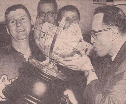 Portland Buckaroos Coach Hal Laycoe drinks from Lester Patrick Cup 1965