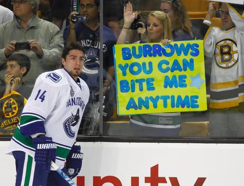 Alex Burrows and a Fan with a Bite Me sign