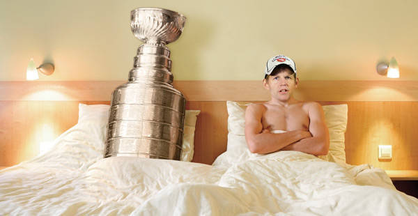 Chris Osgood in bed with the Stanley Cup