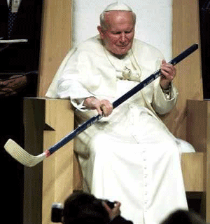 The Pope holding a Ice Hockey Stick the wrong way