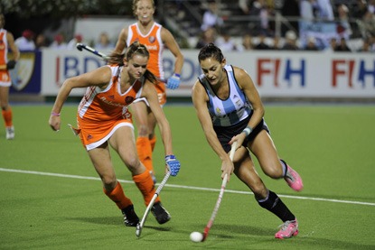Luciana Aymar from Argentina battles against The Netherlands