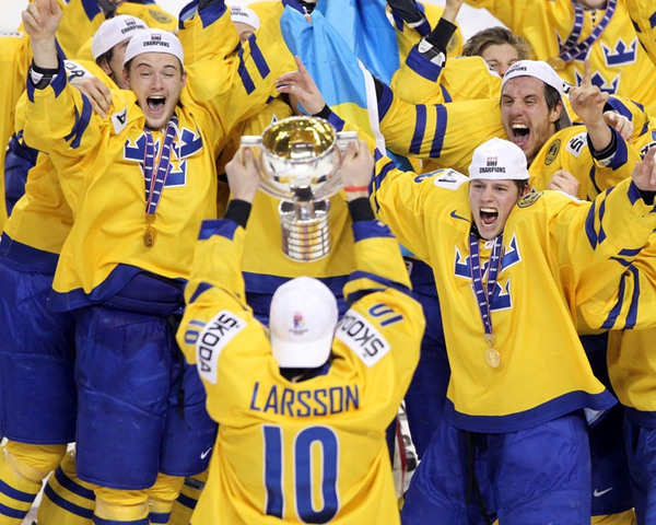 World Championship Trophy being skated to Sweden Teammates