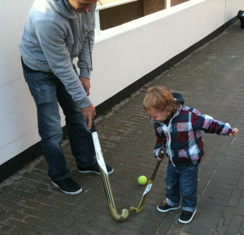 Jamie Dwyer playing some Street Hockey with his son Jules