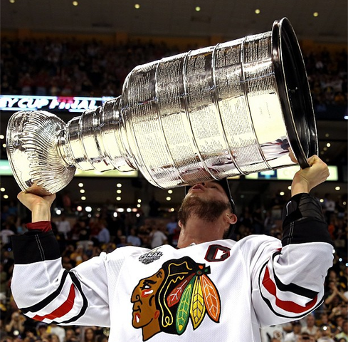 Jonathan Toews Hoisting & Kissing The Stanley Cup - 2013