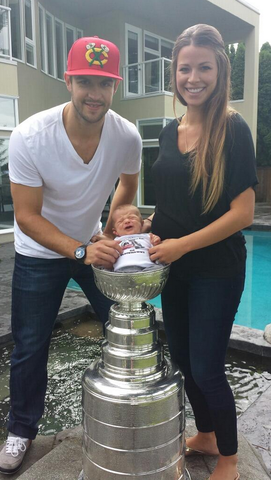 Brent & Dayna Seabrook with baby Carter inside Stanley Cup Bowl