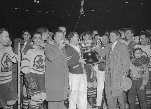 Calgary Stampeders Pat Lundy holds WHL Presidents Trophy in 1954
