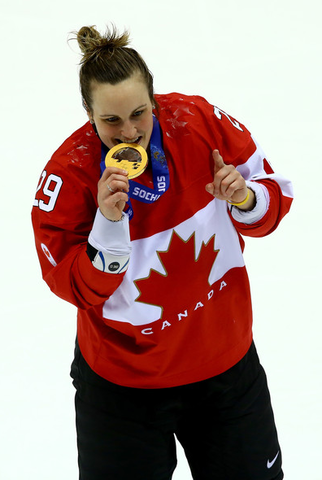 Marie-Philip Poulin Bites her 2014 Winter Olympics Gold Medal