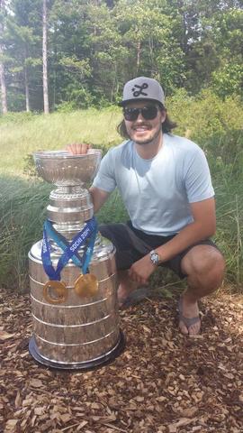 Drew Doughty Hanging his 2 Olympic Gold Medals on Stanley Cup