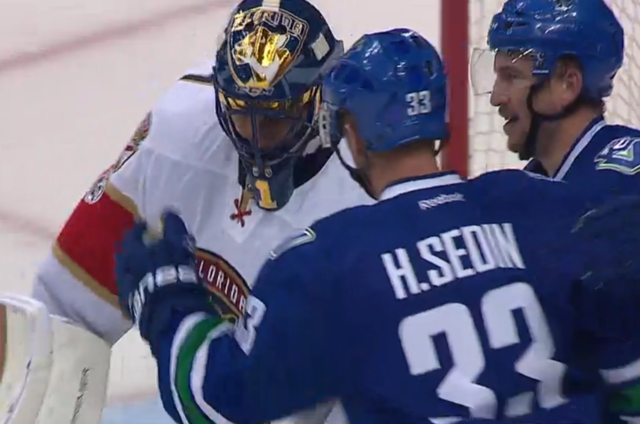 Henrik Sedin Scores his 1000 point as a Canuck, and is congratulated by Luongo