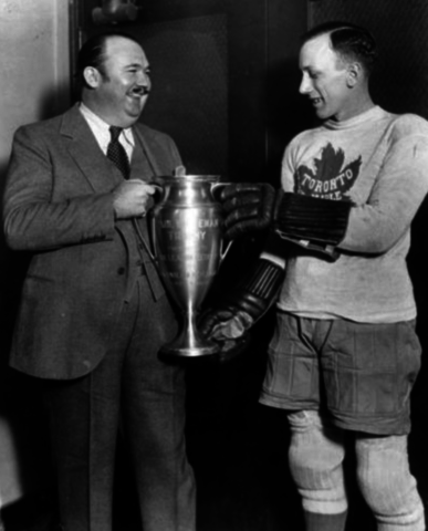 Paul Whiteman Presents Ace Bailey the Paul Whiteman Trophy as NHL Scoring Champ