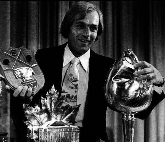 Guy Lafleur with the 1977 Conn Smythe Trophy & 1977 Hart Trophy