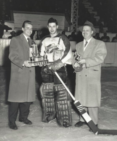Glenn Hall receives the 1955 Edmonton Flyers team MVP award.
