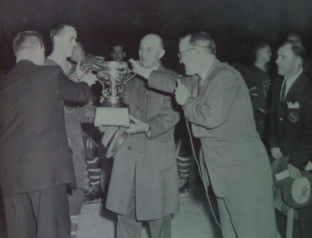 Springfield Indians owner Eddie Shore accepts 1960 Calder Cup for AHL Champions