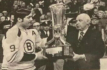 Johnny Bucyk accepts Prince of Wales Trophy from NHL President Clarence Campbell