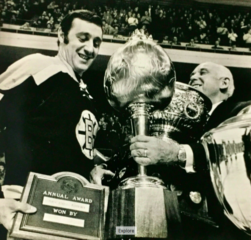 Phil Esposito accepts 1969 Hart Trophy & Art Ross Trophy from Clarence Campbell