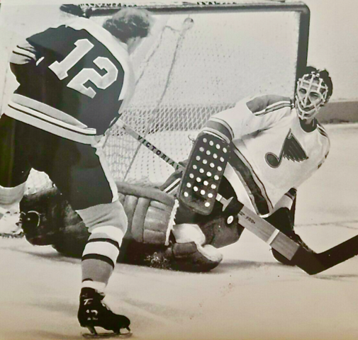 St. Louis Blues Jacques Caron makes save against Wayne Cashman of Boston 1972