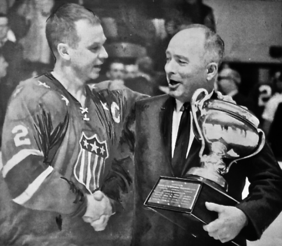 Don Cherry accepts the 1968 Calder Cup from AHL President Jack Butterfield