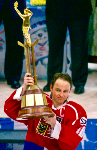 Pavel Patera holds up champions trophy for 1999 IIHF World Championships