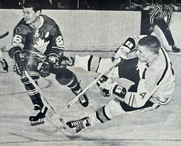 Allan Stanley checks rookie Bobby Orr who still gets his shot off 1967