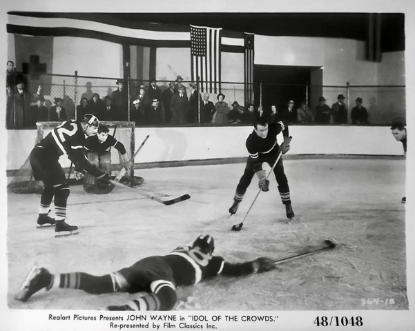 Hockey Movie - John Wayne with the puck in Idol of the Crowds 1937