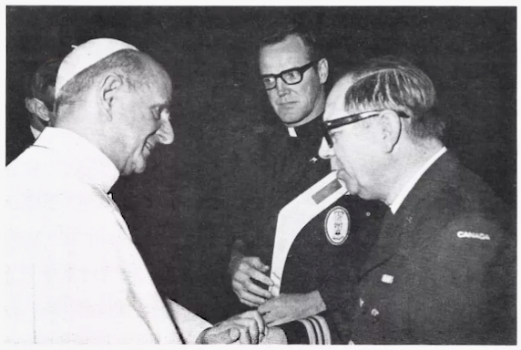 Pope Paul VI receives Hockey Stick from Father Brian Mckee and Major Raymond