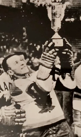 Ike Hildebrand lifts the 1959 Ice Hockey World Championship Trophy