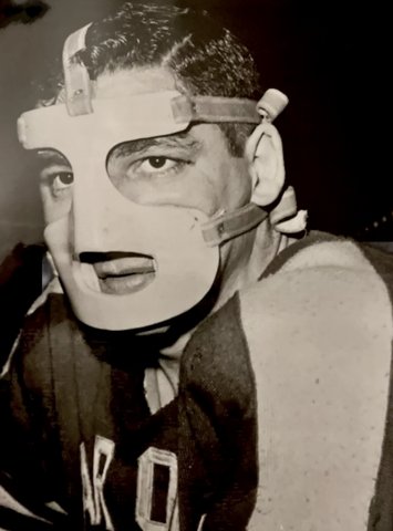 Cleveland Barons Fred Glover wearing Hockey Mask to protect broken nose 1959