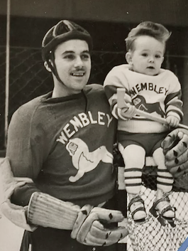 Wembley Lions Sonny Rost holding up team mascot and son Larry Rost 1938