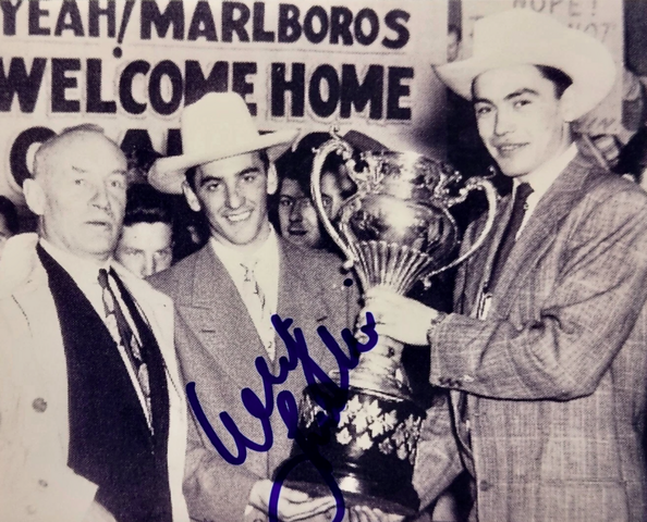 Conn Smythe, Danny Lewicki and George Armstrong hold the 1950 Allan Cup