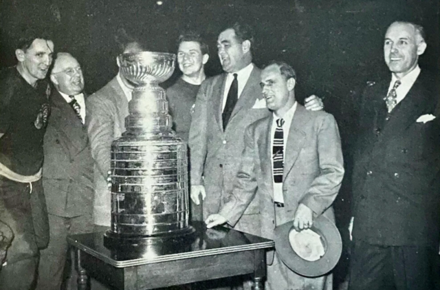 Sid Abel, Jack Adams, Harry Lumley, Jim Norris, Tommy Ivan, Clarence Campbell