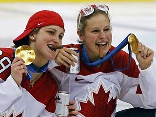 Team Canada Women share a Stogi and Beer after winning the Gold
