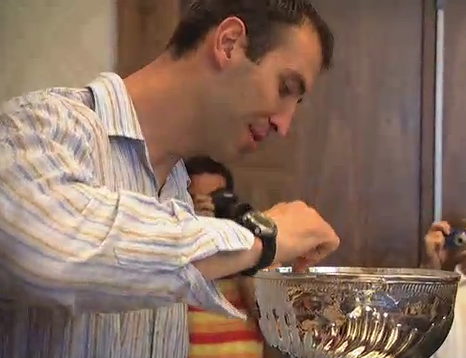 Zdeno Chara eats from the bowl of the Stanley Cup 2011
