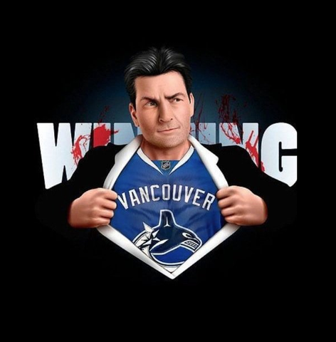 Charlie Sheen showing a Vancouver Canucks Jersey