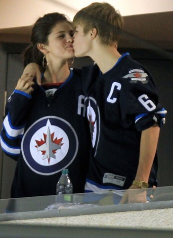 Justin Bieber with Selena Gomez at Winnipeg Jets game 