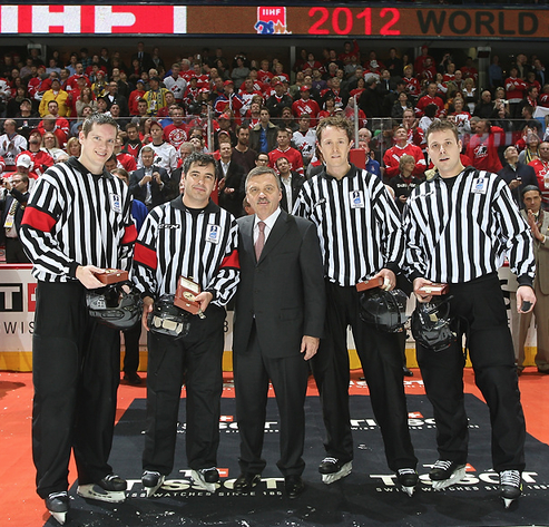 Rene Fasel with the Referee's & Linesmen after Gold Medal game