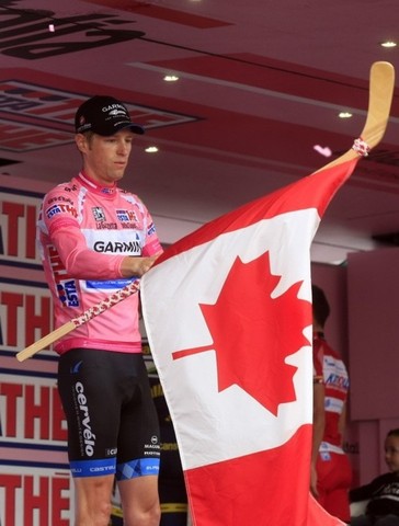 Ryder Hesjedal Waves a Canada Hockey Stick Flag at Giro d'Italia